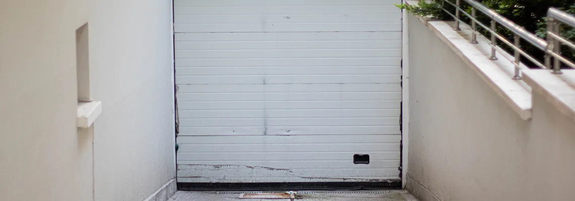 Overhead Bent Garage Door Repair in Ross Industrial Park, SK