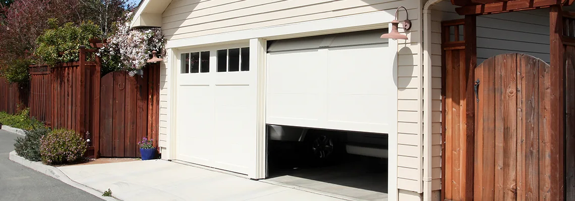 Fix Metal Garage Door Jerking in Fairways West, SK